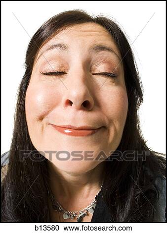 Closeup of woman with funny face eyes closed View Large Photo Image Stock Image - Closeup of woman with funny face eyes closed. Fotosearch