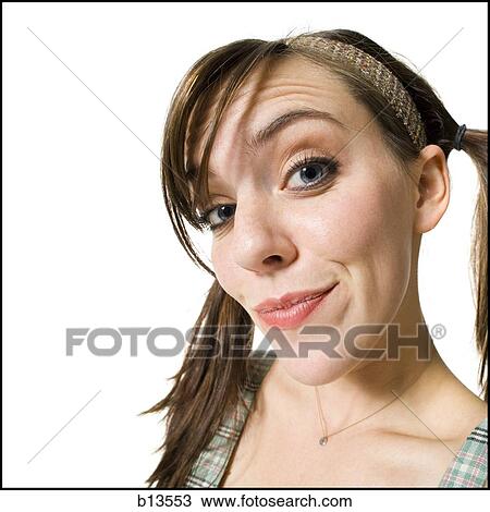 Stock Image - Closeup of woman with pigtails. Fotosearch