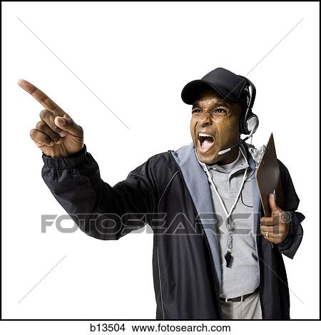Coach shouting and pointing View Large Photo Image Picture - Coach shouting and pointing. Fotosearch