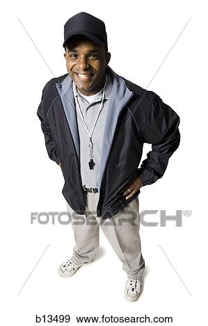 Coach with cap and whistle smiling View Large Photo Image Stock Photo - Coach with cap and whistle smiling. Fotosearch