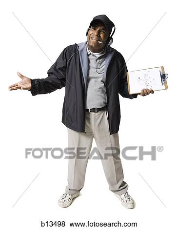 Coach with clipboard and headset shrugging View Large Photo Image Stock Photo - Coach with clipboard and headset shrugging. Fotosearch