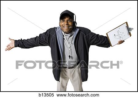 Coach with clipboard and headset questioning View Large Photo Image Stock Photography - Coach with clipboard and headset questioning. Fotosearch