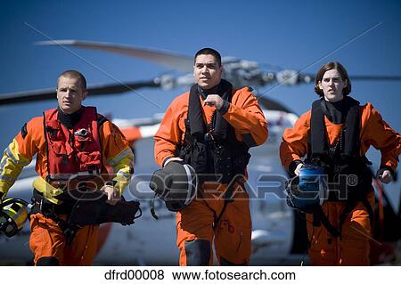 Coast guard workers in uniforms with helicopter View Large Photo Image Stock Photo - Coast guard workers in uniforms with helicopter. Fotosearch