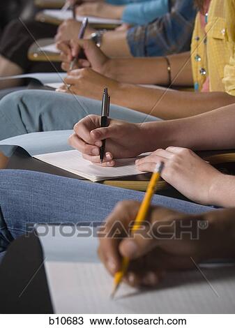 College students writing and taking notes View Large Photo Image Stock Image - College students writing and taking notes. Fotosearch