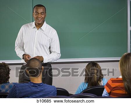 College teacher giving a lesson in classroom View Large Photo Image Stock Photography - College teacher giving a lesson in classroom. Fotosearch