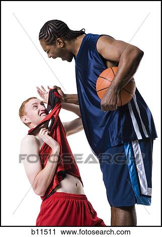 Stock Image - Confrontation between two basketball players. Fotosearch