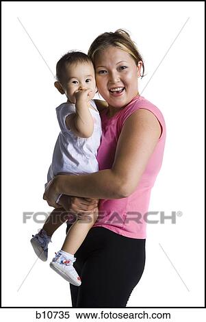 Contortionist mother with baby daughter View Large Photo Image Stock Photography - Contortionist mother with baby daughter. Fotosearch