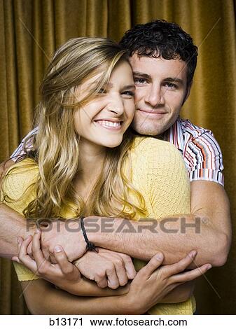 Couple in photo booth embracing View Large Photo Image Stock Image - Couple in photo booth embracing. Fotosearch