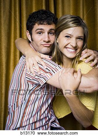 Couple in photo booth smiling View Large Photo Image Stock Image - Couple in photo booth smiling. Fotosearch