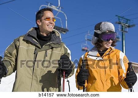 Couple skiing View Large Photo Image Stock Photo - Couple skiing. Fotosearch