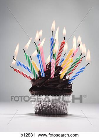 Cupcake with birthday candles View Large Photo Image Stock Image - Cupcake with birthday candles. Fotosearch