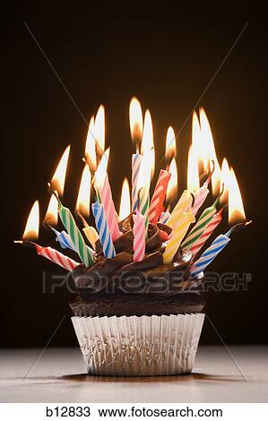 Cupcake with birthday candles View Large Photo Image Stock Image - Cupcake with birthday candles. Fotosearch
