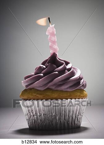 Cupcake with one birthday candle View Large Photo Image Picture - Cupcake with one birthday candle. Fotosearch