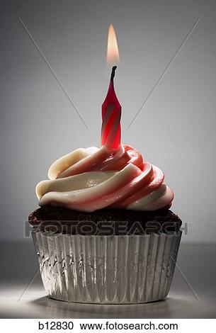Stock Image - Cupcake with one birthday candle. Fotosearch
