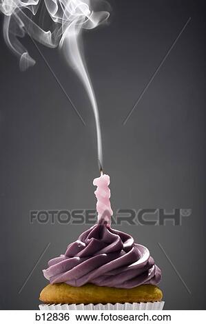 Cupcake with one birthday candle View Large Photo Image Stock Photograph - Cupcake with one birthday candle. Fotosearch