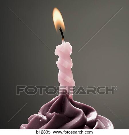 Cupcake with one birthday candle View Large Photo Image Stock Photography - Cupcake with one birthday candle. Fotosearch