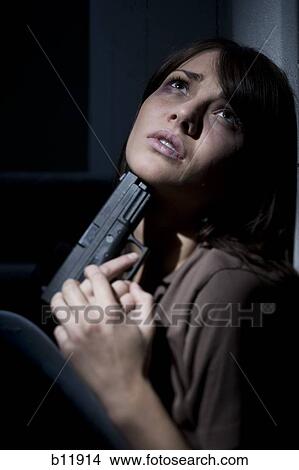 Picture - Depressed and suicidal young woman. Fotosearch
