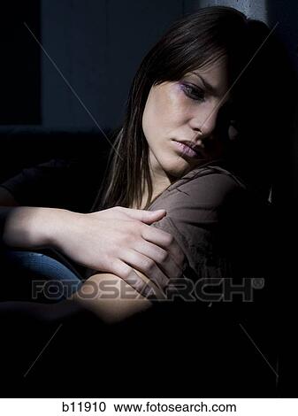 Stock Image - Depressed young woman. Fotosearch