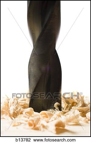 Detailed view of drill bit in wood with shavings View Large Photo Image Stock Image - Detailed view of drill bit in wood with shavings. Fotosearch