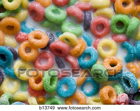 Stock Photo - Detailed view of multicolored cereal in milk. Fotosearch