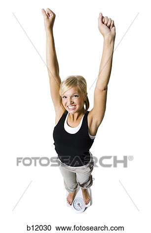 Dieting woman standing on bathroom scale View Large Photo Image Stock Image - Dieting woman standing on bathroom scale. Fotosearch