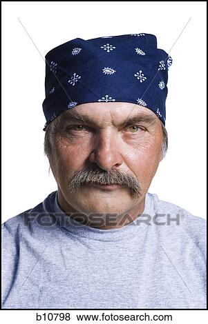 Stock Photo - Disheveled middle aged man with head scarf. Fotosearch