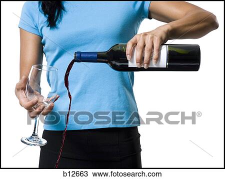 Distracted woman pouring red wine and missing glass View Large Photo Image Stock Image - Distracted woman pouring red wine and missing glass. Fotosearch