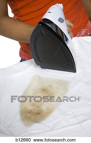 Distracted woman with iron and burned clothing View Large Photo Image Stock Image - Distracted woman with iron and burned clothing. Fotosearch