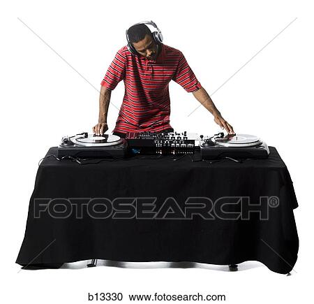 DJ with headphones spinning records View Large Photo Image Stock Image - DJ with headphones spinning records. Fotosearch