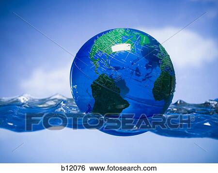 Earth globe floating in water View Large Photo Image Stock Photograph - Earth globe floating in water. Fotosearch