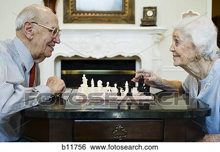 Elderly couple playing chess View Large Photo Image Stock Photograph - Elderly couple playing chess. Fotosearch