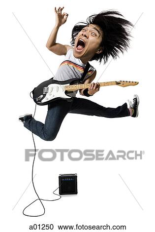 Electric guitar player jumping View Large Photo Image Stock Image - Electric guitar player jumping. Fotosearch