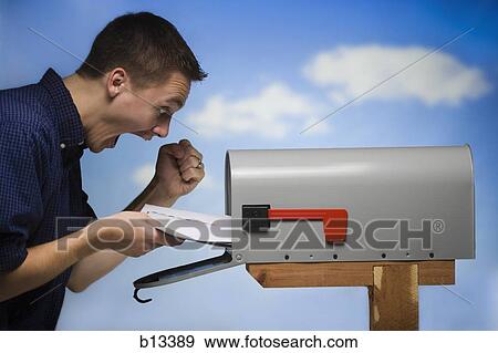 Stock Photo - Excited man getting mail. Fotosearch