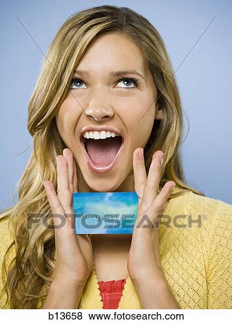 Excited woman with credit card View Large Photo Image Stock Photo - Excited woman with credit card. Fotosearch
