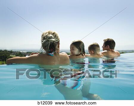 Family in infinity pool View Large Photo Image Stock Photo - Family in infinity pool. Fotosearch