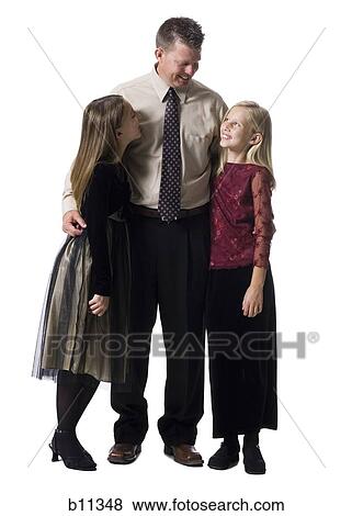 Stock Photo - Family portrait of father and daughters. Fotosearch