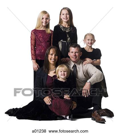 Stock Photo - Family portrait of parents and daughters. Fotosearch