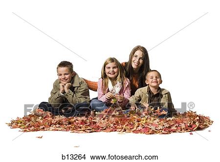 Family sitting in autumn leaves View Large Photo Image Picture - Family sitting in autumn leaves. Fotosearch