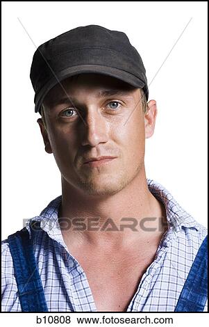 Stock Photo - Farmer wearing a ball cap. Fotosearch