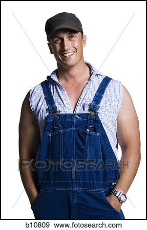 Farmer wearing a ball cap with hands in pockets View Large Photo Image Stock Photo - Farmer wearing a ball cap with hands in pockets. Fotosearch