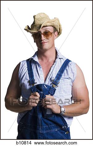 Farmer wearing a straw hat with sunglasses View Large Photo Image Picture - Farmer wearing a straw hat with sunglasses. Fotosearch