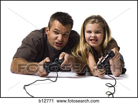 Stock Image - Father and daughter playing a video game. Fotosearch