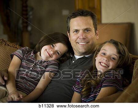 Stock Photo - Father and daughters. Fotosearch