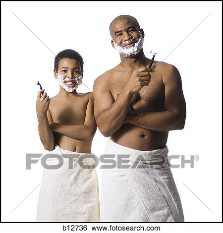 Stock Photograph - Father and son shaving together. Fotosearch