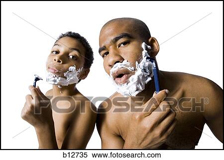 Father and son shaving together View Large Photo Image Stock Photography - Father and son shaving together. Fotosearch