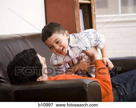 Father and young son playing View Large Photo Image Stock Photo - Father and young son playing. Fotosearch