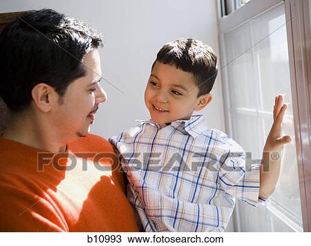 Father and young son talking View Large Photo Image Stock Image - Father and young son talking. Fotosearch