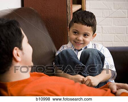 Father and young son talking View Large Photo Image Stock Photo - Father and young son talking. Fotosearch
