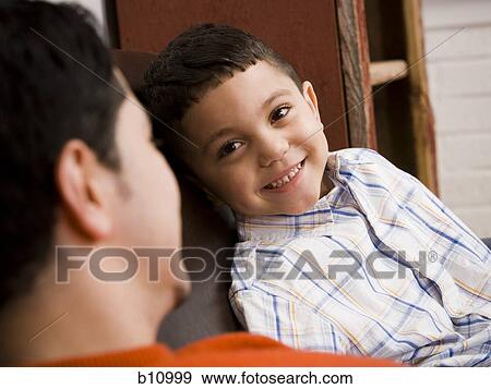 Father and young son talking View Large Photo Image Stock Photo - Father and young son talking. Fotosearch