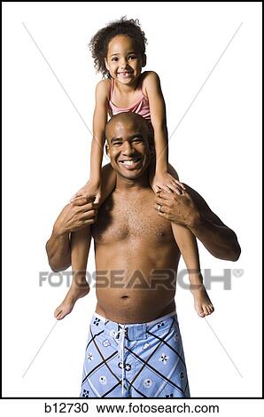 Stock Image - Father holding young daughter. Fotosearch